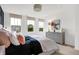 Well-lit bedroom with plush bedding, window blinds, neutral carpet, and a view to the neighborhood at 3924 Andean Ct, Bargersville, IN 46106