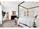 Bright bedroom featuring a four-poster bed, modern decor, and a view to the ensuite at 3924 Andean Ct, Bargersville, IN 46106