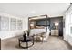 Comfortable bedroom featuring a four-poster bed, seating area, and modern decor at 3924 Andean Ct, Bargersville, IN 46106