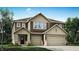 Charming two-story home with a two-car garage and beautifully landscaped front yard, inviting curb appeal at 3924 Andean Ct, Bargersville, IN 46106