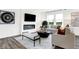 Cozy living room featuring a modern fireplace, neutral furnishings, and bright, natural light at 3924 Andean Ct, Bargersville, IN 46106