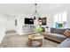 Bright living room featuring modern lighting, large windows, and a comfortable sofa at 3924 Andean Ct, Bargersville, IN 46106