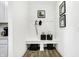 Organized mudroom with white bench, coat hooks, stylish storage baskets, and elegant wall décor at 3924 Andean Ct, Bargersville, IN 46106