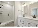 Modern bathroom with dual sink vanity and walk-in shower with decorative tile at 3936 Sterling Dr, Whitestown, IN 46075