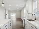 Stylish kitchen with white countertops, tile backsplash, stainless steel appliances, and dark hardware at 3936 Sterling Dr, Whitestown, IN 46075