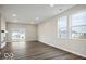 Bright living room with sleek floors, recessed lighting, fireplace and large windows for natural light at 3936 Sterling Dr, Whitestown, IN 46075