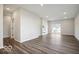 Large living room with sleek flooring, recessed lighting, and a sliding glass door for ample natural light at 3936 Sterling Dr, Whitestown, IN 46075