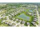 Scenic aerial view of a well-designed neighborhood with homes surrounding a tranquil pond at 4659 W Otway Ln, New Palestine, IN 46163
