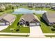 Inviting brick home with an extended driveway, situated in a beautiful neighborhood with a serene pond at 4659 W Otway Ln, New Palestine, IN 46163