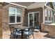 This backyard boasts a patio, dining area, and built in grill perfect for outdoor entertaining at 4659 W Otway Ln, New Palestine, IN 46163