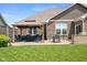 Spacious backyard patio features a covered gazebo, outdoor dining space, and built-in grill for easy entertaining at 4659 W Otway Ln, New Palestine, IN 46163