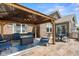 Backyard patio featuring a beautiful gazebo with cozy seating and an outdoor dining area with a built-in grill at 4659 W Otway Ln, New Palestine, IN 46163