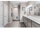 Bright bathroom with a double vanity, large mirror, and step-in shower at 4659 W Otway Ln, New Palestine, IN 46163