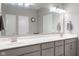 Modern bathroom featuring a double vanity, white countertops, and stylish lighting at 4659 W Otway Ln, New Palestine, IN 46163