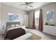 Neutral bedroom featuring a large bed with decorative pillows, soft lighting, and artwork at 4659 W Otway Ln, New Palestine, IN 46163