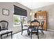 Elegant dining area featuring a round table, stylish chairs, and a view of the lake at 4659 W Otway Ln, New Palestine, IN 46163