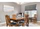 Bright dining room with classic wood furniture and a view into the living area, great for entertaining at 4659 W Otway Ln, New Palestine, IN 46163