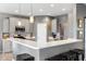 Well-lit kitchen with stainless steel appliances, light cabinetry, and counter seating at 4659 W Otway Ln, New Palestine, IN 46163