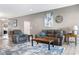 Spacious living room featuring comfortable seating, a stylish rug, and contemporary decor at 4659 W Otway Ln, New Palestine, IN 46163