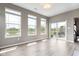 Bright living room with large windows overlooking the water and backyard patio at 4659 W Otway Ln, New Palestine, IN 46163