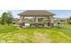Charming community pavilion overlooking a pond, ideal for picnics and gatherings at 4659 W Otway Ln, New Palestine, IN 46163