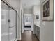 Modern bathroom featuring a glass shower and a view into the bedroom at 5151 Nettleton Way, Avon, IN 46123