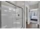 Bright bathroom showcasing a glass shower with a view into the bedroom at 5151 Nettleton Way, Avon, IN 46123