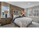 Stylishly designed bedroom features a wood accent wall and a well-lit window at 5151 Nettleton Way, Avon, IN 46123