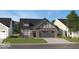 Charming single-Gathering home with brick facade, a two-car garage, and manicured lawn at 5151 Nettleton Way, Avon, IN 46123