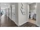 Hallway leading to an open floor plan with visible doors to a bathroom and other rooms at 5151 Nettleton Way, Avon, IN 46123