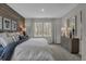 Comfortable main bedroom features a wood accent wall and large windows at 5151 Nettleton Way, Avon, IN 46123