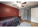 Comfortable bedroom with hardwood floors, an area rug, and natural lighting at 5225 E St Clair St, Indianapolis, IN 46219