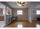 Cozy dining area with hardwood floors and ceiling fan, perfect for Gathering meals and gatherings at 5225 E St Clair St, Indianapolis, IN 46219
