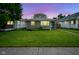 Beautifully maintained front lawn and exterior of a cozy home in the evening, showcasing its curb appeal at 5225 E St Clair St, Indianapolis, IN 46219