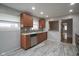 Updated kitchen features stainless steel appliances, mosaic backsplash, and great natural light at 5225 E St Clair St, Indianapolis, IN 46219