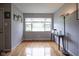Bright living room features hardwood floors, a large window, and ample space for entertaining at 5225 E St Clair St, Indianapolis, IN 46219