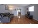 Spacious living room with hardwood floors and comfortable seating, creating a warm and inviting atmosphere at 5225 E St Clair St, Indianapolis, IN 46219