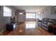Spacious living room with hardwood floors and comfortable seating, creating a warm and inviting atmosphere at 5225 E St Clair St, Indianapolis, IN 46219