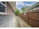 Exterior shot of a side yard with privacy fence and stone landscaping at 5225 E St Clair St, Indianapolis, IN 46219