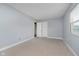 This bedroom offers soft carpeting and plenty of closet space at 5236 Honey Comb Ln, Indianapolis, IN 46221