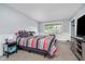 This bedroom is spacious with carpeted floors, providing comfort and a cozy feel at 5236 Honey Comb Ln, Indianapolis, IN 46221