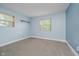 This bedroom features cozy carpet and a simple shelf at 5236 Honey Comb Ln, Indianapolis, IN 46221