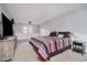 Spacious bedroom featuring soft carpet, a modern color scheme, and a large window for natural light at 5236 Honey Comb Ln, Indianapolis, IN 46221