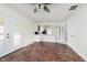 Bright dining room with tile flooring, french doors, and an open view to the kitchen at 5236 Honey Comb Ln, Indianapolis, IN 46221