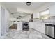 Modern kitchen showcasing white cabinetry, stainless steel appliances, and an open layout perfect for entertaining at 5236 Honey Comb Ln, Indianapolis, IN 46221