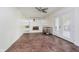 Cozy living room with brick fireplace, built-in shelving, and natural light, with tile flooring at 5236 Honey Comb Ln, Indianapolis, IN 46221