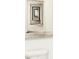 Cool modern art print on a wall above a toilet in a minimalist style bathroom at 5312 Summerton St, McCordsville, IN 46055