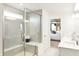 Bathroom featuring a glass shower and double vanity with a view into the bedroom at 5312 Summerton St, McCordsville, IN 46055
