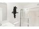 Modern bathroom with a frameless glass shower, sleek sink and decorative wall art offering a stylish design at 5312 Summerton St, McCordsville, IN 46055