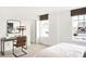 Bright bedroom featuring a modern desk, chair, and a view from the large window at 5312 Summerton St, McCordsville, IN 46055